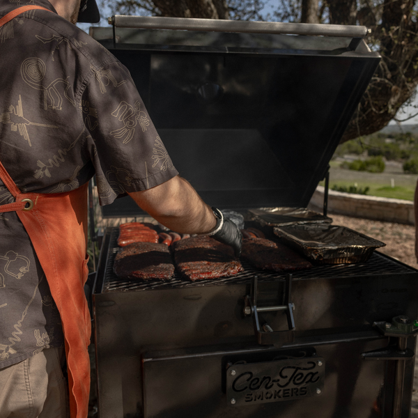 Cooking ribs on a backyard bbq smoker.