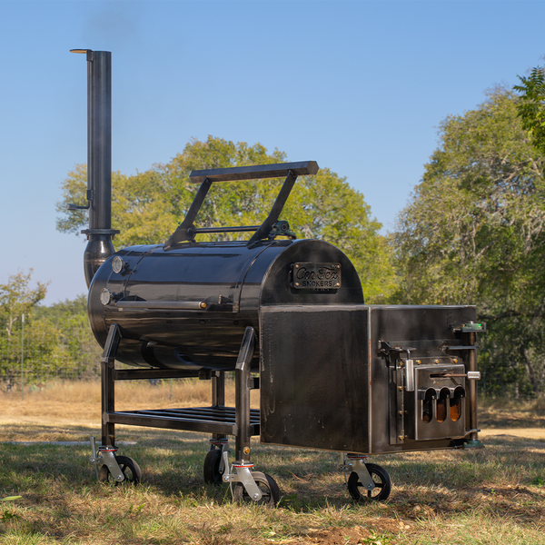 A handmade, offset BBQ smoker in a backyard. 