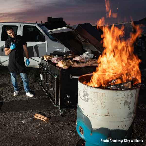 en-Tex Smokers direct-heat cooker in action, firing up classic whole hog barbecue with bold, smoky flavor.